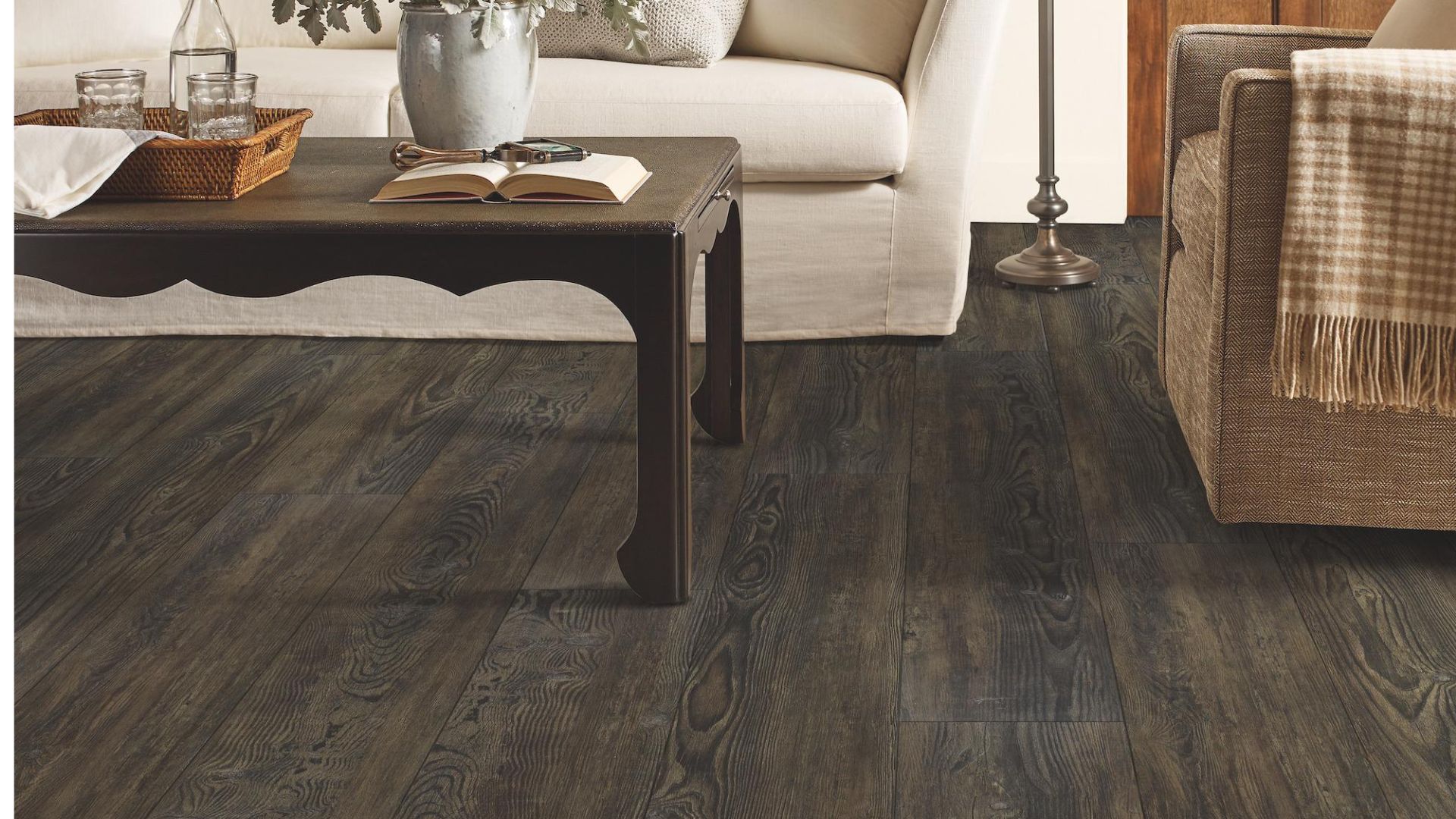 dark stained luxury vinyl plank flooring in a charming living room